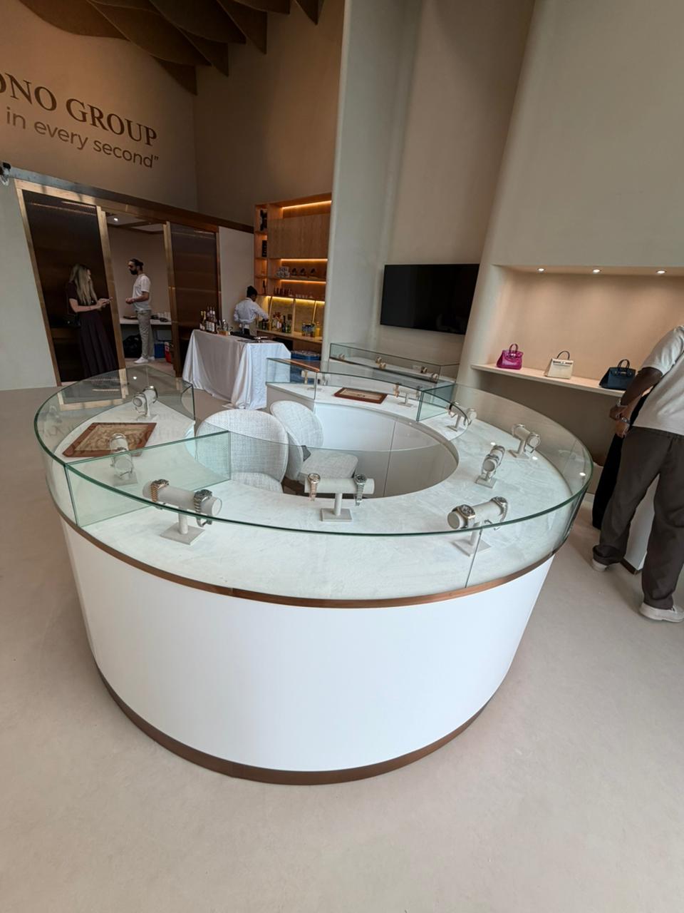 Chrono Group glass watch display island inside the Dubai Hills boutique.