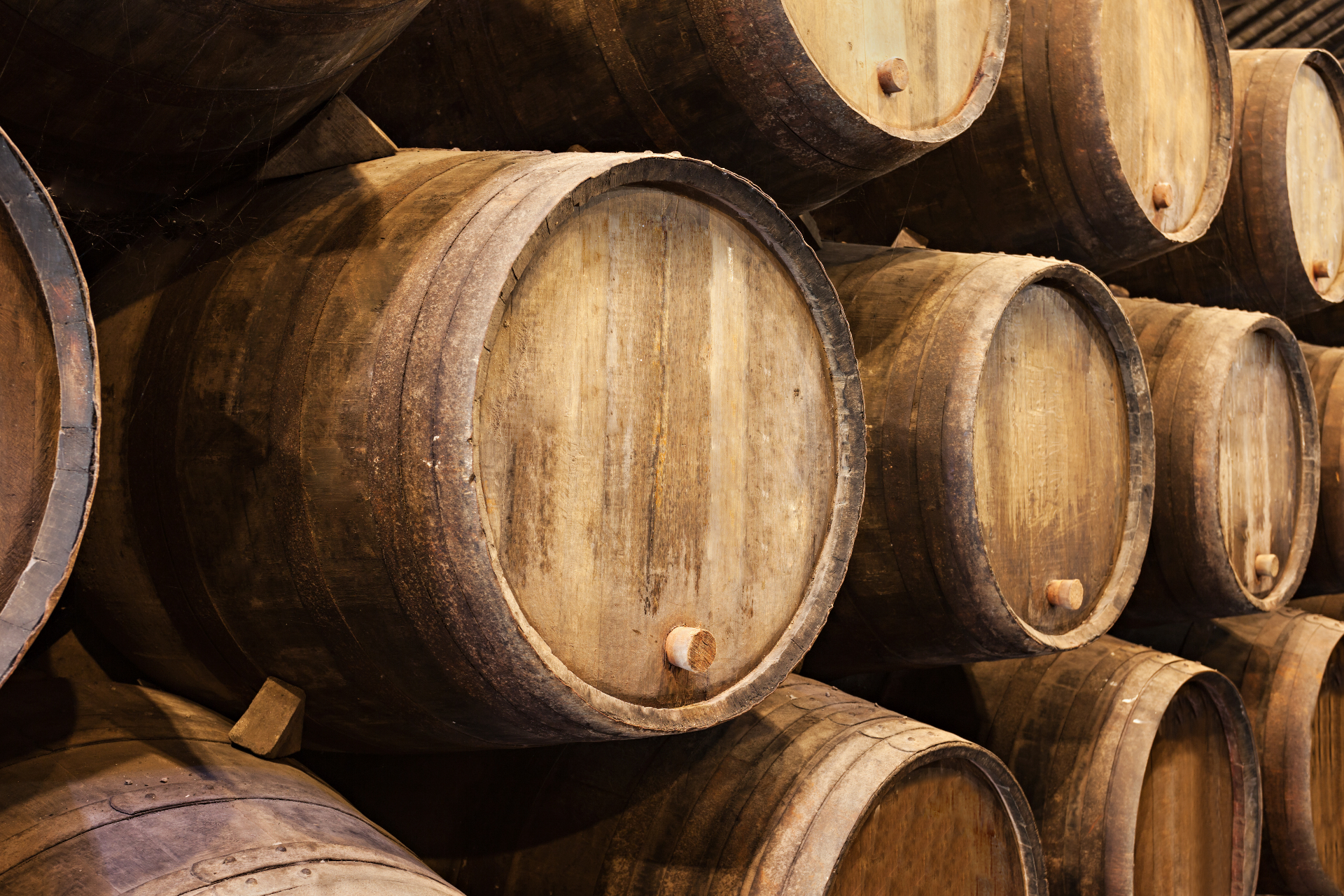 Stacked whisky casks in storage for Tavrix Group.