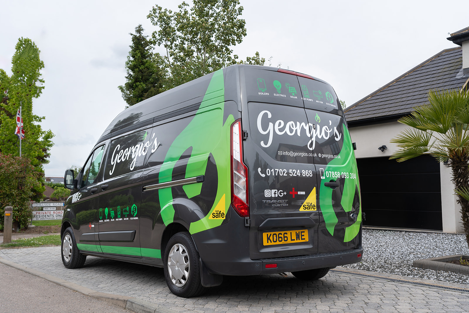Georgios branded service van on a residential driveway.
